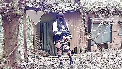 Brunette masturbates in an abandoned house outdoors