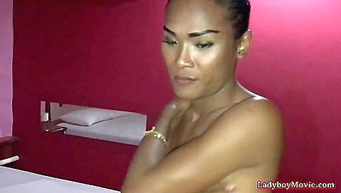 Asian brunette with big tits and ass in a doggy position